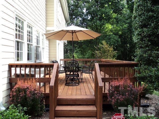 6900 Wilderness Road Raleigh, NC 27613 - Photo 22 of 25 a view of balcony with outdoor seating and wooden floor
