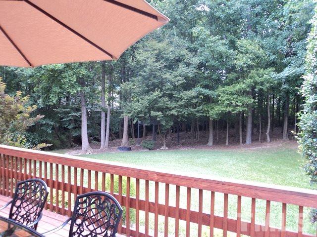 6900 Wilderness Road Raleigh, NC 27613 - Photo 23 of 25 a view of a wooden deck