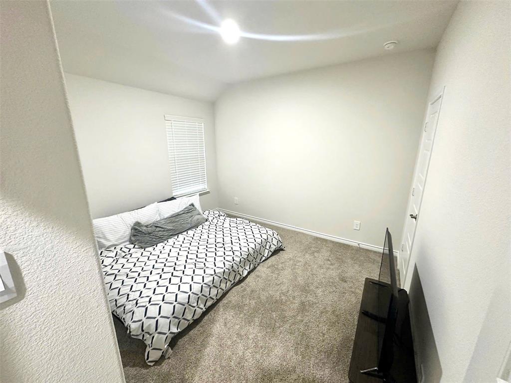 324 Revolution Road Fate, TX 75189 - Photo 7 of 15 Carpeted room with neutral wall tones and a window featuring horizontal blinds