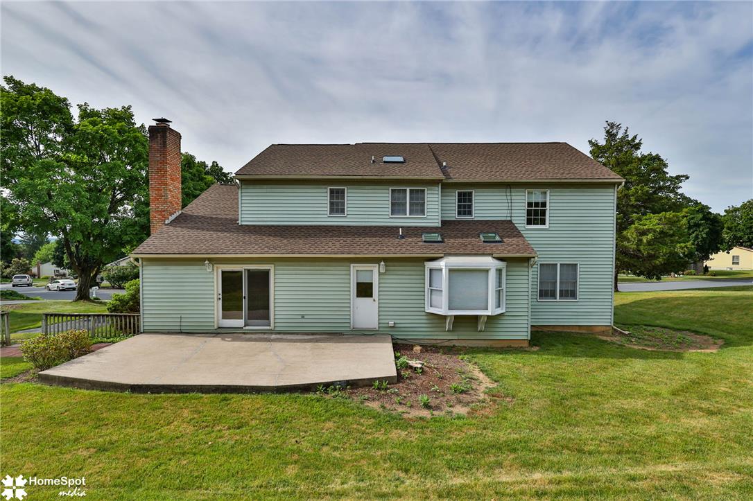 4059 Wedgewood Road Allentown, PA 18104 - Photo 69 of 72 A classic two-story home with a spacious concrete patio perfect for outdoor enjoyment.