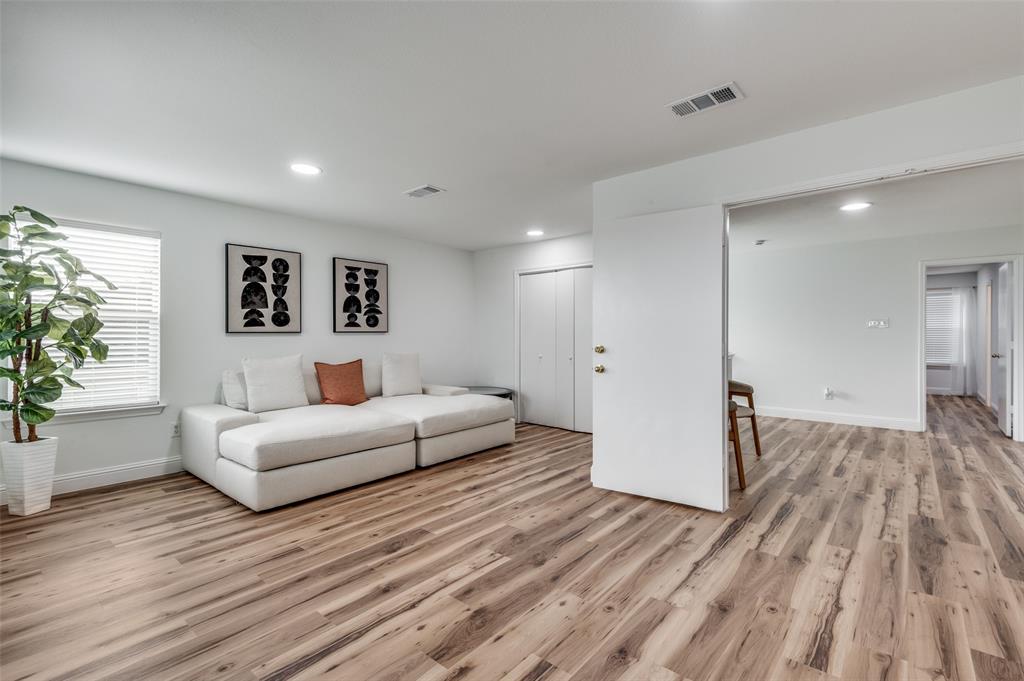 2416 Big Spring Drive Fort Worth, TX 76120 - Photo 20 of 36 a living room with furniture and a wooden floor
