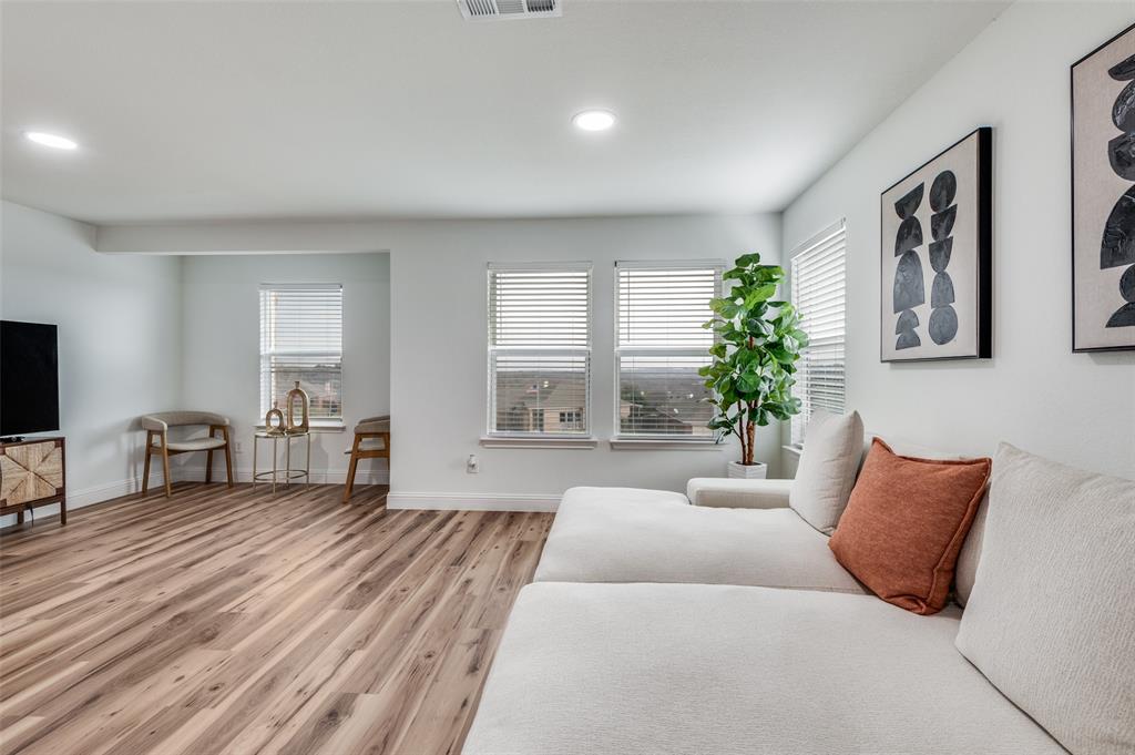 2416 Big Spring Drive Fort Worth, TX 76120 - Photo 21 of 36 a living room with furniture and a large window