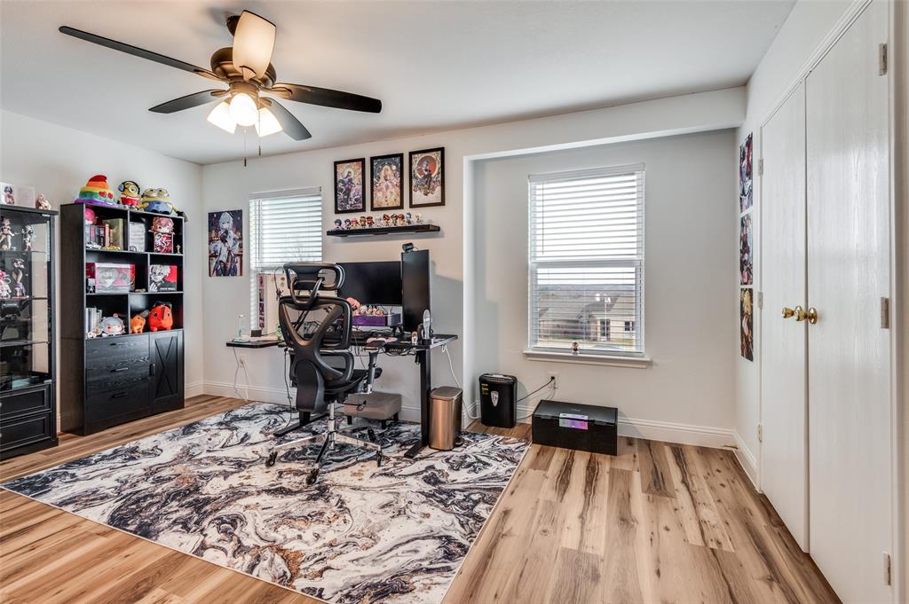 2416 Big Spring Drive Fort Worth, TX 76120 - Photo 23 of 36 a view of a workspace with furniture and a window