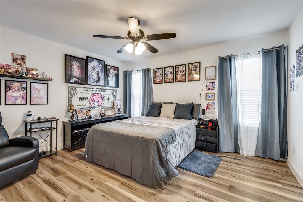 2416 Big Spring Drive Fort Worth, TX 76120 - Photo 33 of 36 a bedroom with a bed and furniture