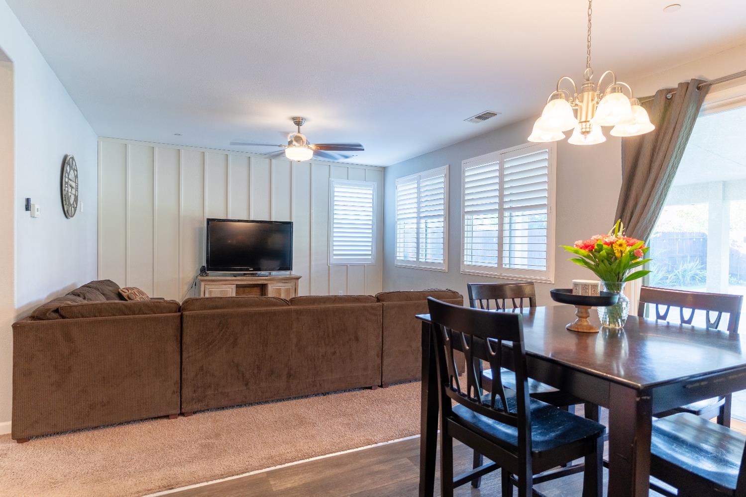 1358 Tevin Way Madera, CA 93637 - Photo 2 of 13 a view of a dining room with furniture window and wooden floor
