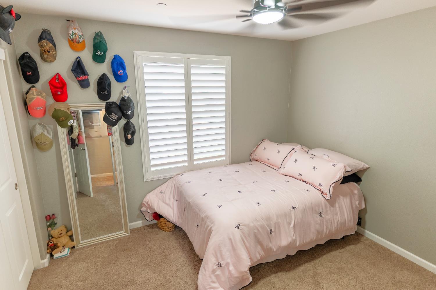 1358 Tevin Way Madera, CA 93637 - Photo 8 of 13 a bedroom with a bed and a chandelier