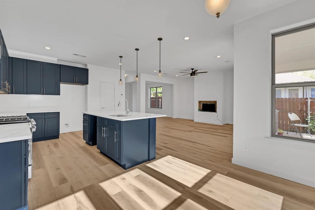 7305 Charbonneau Road Lake Worth, TX 76135 - Photo 18 of 40 a kitchen with stainless steel appliances kitchen island sink stove and cabinets