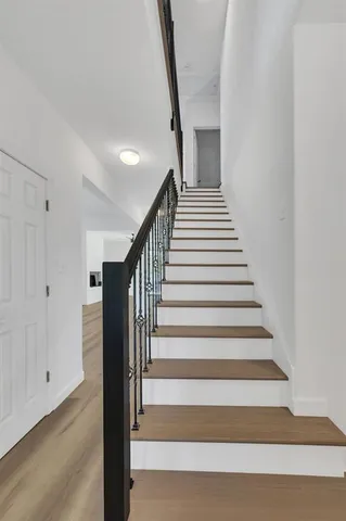a kitchen with stainless steel appliances kitchen island sink stove and cabinets