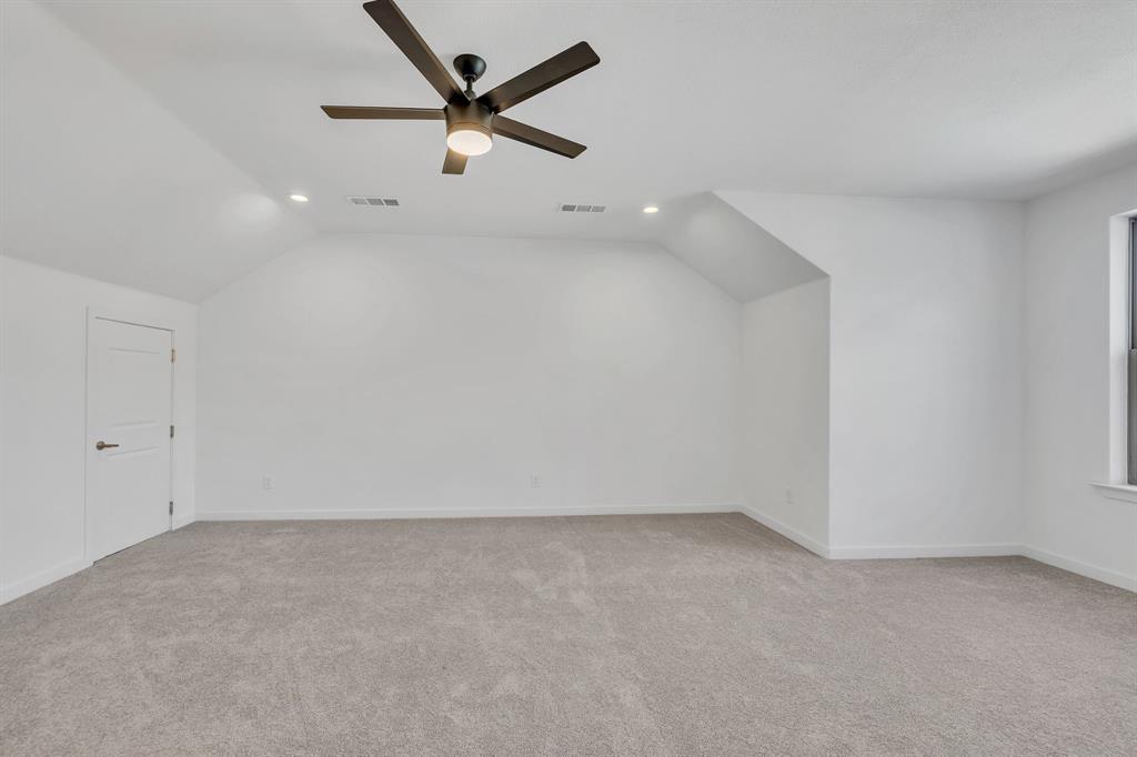 7305 Charbonneau Road Lake Worth, TX 76135 - Photo 21 of 40 an empty room with a ceiling fan and window
