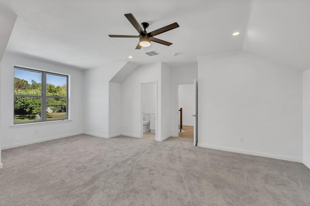 7305 Charbonneau Road Lake Worth, TX 76135 - Photo 22 of 40 an empty room with ceiling fan and window