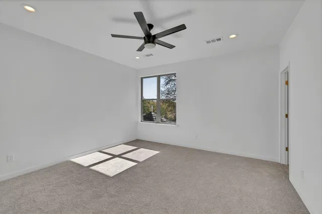 a bathroom with a toilet and vanity