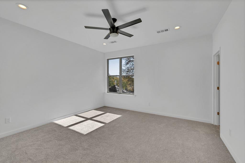 7305 Charbonneau Road Lake Worth, TX 76135 - Photo 25 of 40 an empty room with ceiling fan and window
