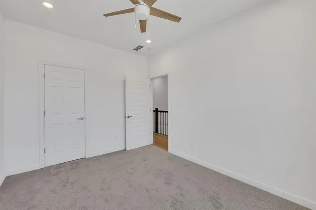 an empty room with windows and outdoor view