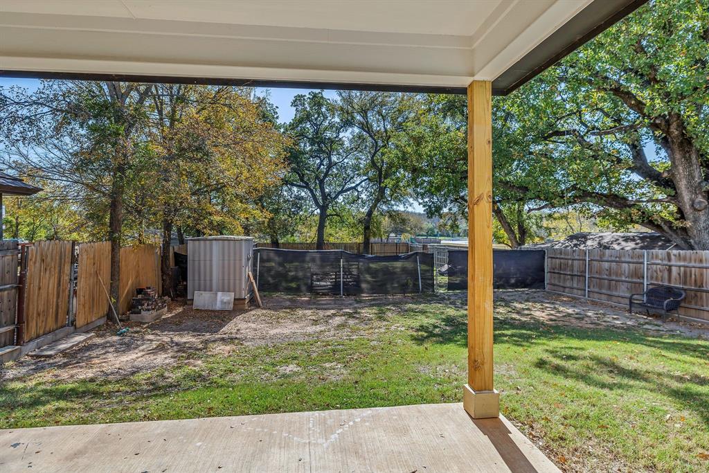 7305 Charbonneau Road Lake Worth, TX 76135 - Photo 34 of 40 a view of a backyard with a garden