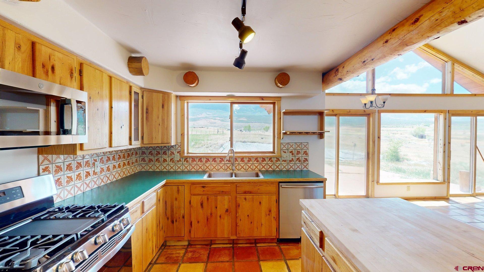 40557 M75 Road Paonia, CO 81428 - Photo 10 of 34 a bedroom with a bed and a large window