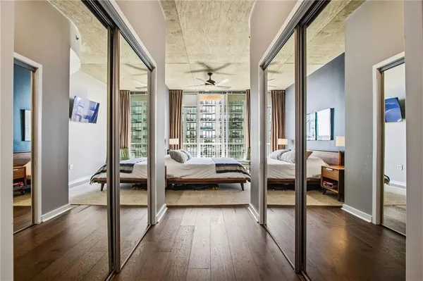 a view of living room with furniture and wooden floor