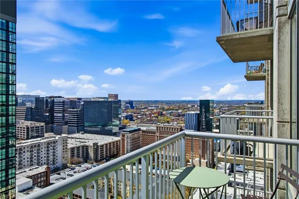 a bedroom with a bed and a night stand