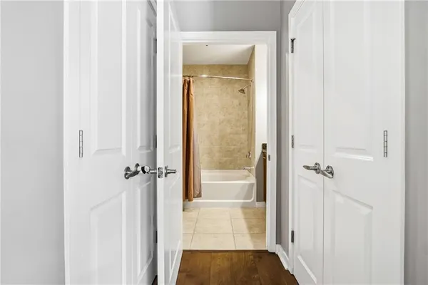 a bathroom with a granite countertop sink and a bathtub