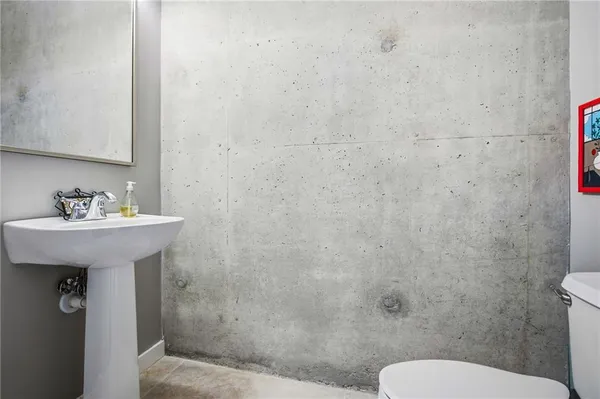 a building outdoor space with patio furniture and potted plants