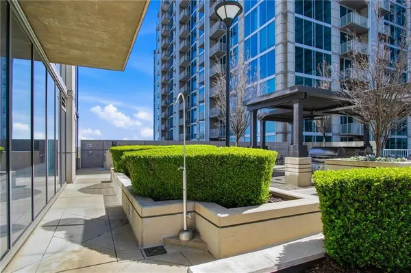 a room with furniture pool table and chairs