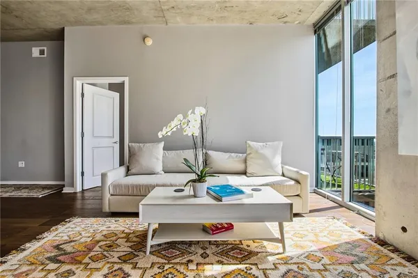 a living room with furniture and a rug