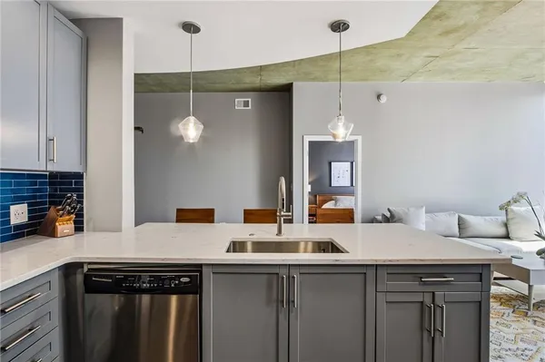 a kitchen with a sink cabinets and window