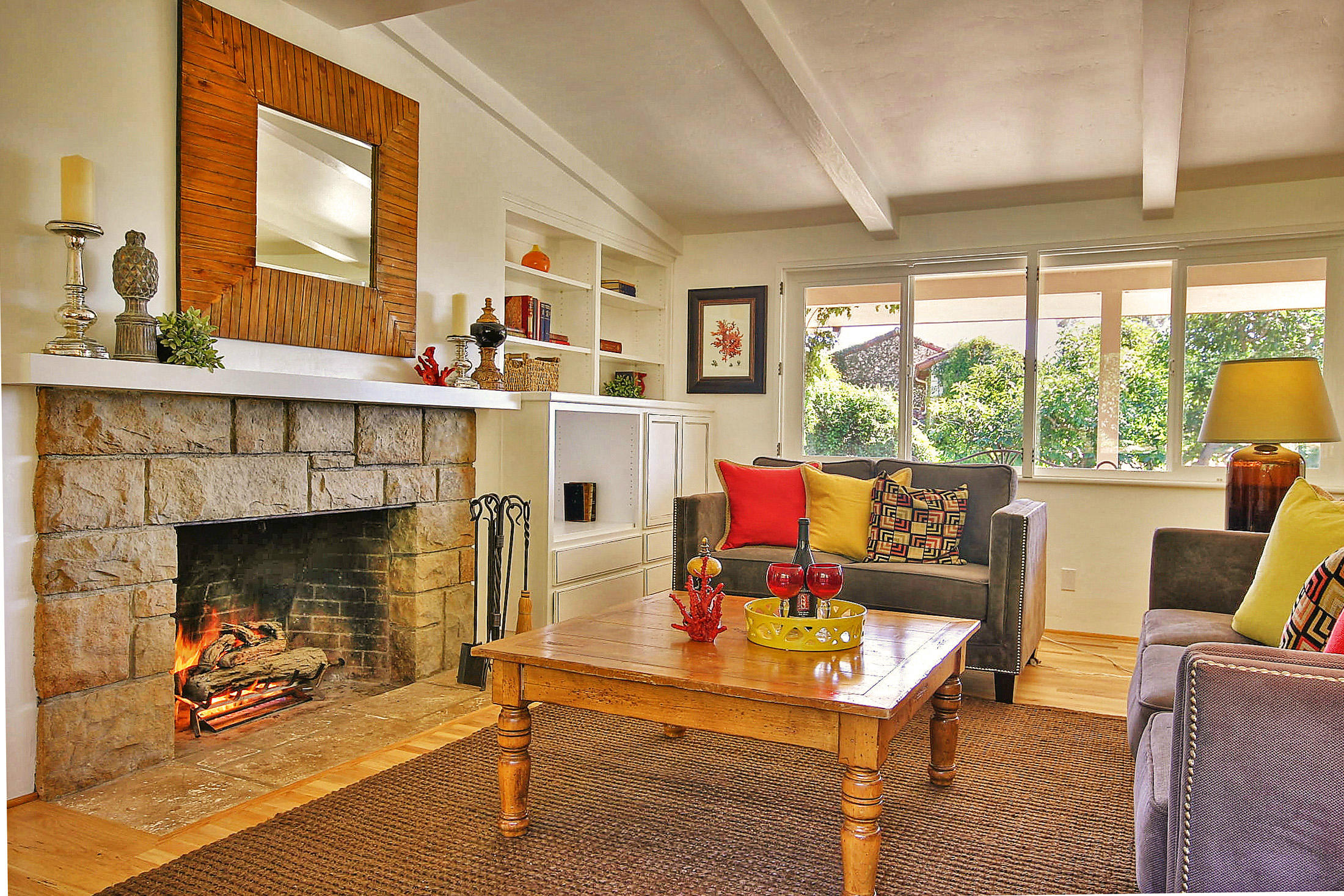 790 Ladera Lane Montecito, CA 93108 - Photo 2 of 13 a living room with furniture a fireplace and a large window