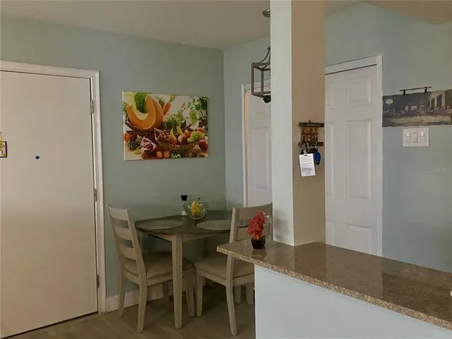 a dining room with furniture and window