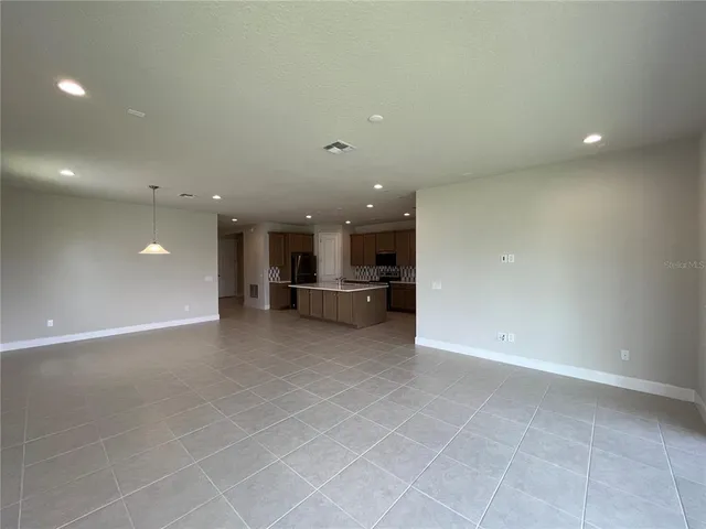 a view of kitchen and windows