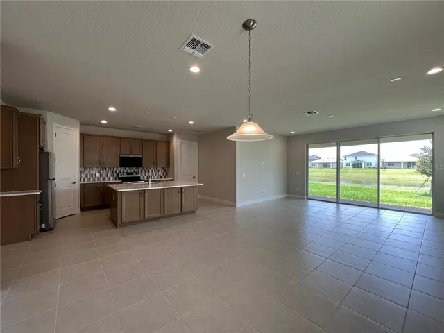 a view of a kitchen with a sink and a stove top oven