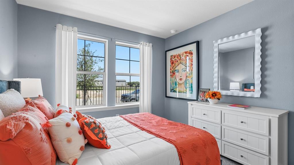 332 Blanco Drive Azle, TX 76020 - Photo 23 of 38 a bedroom with a bed and a dresser next to a window