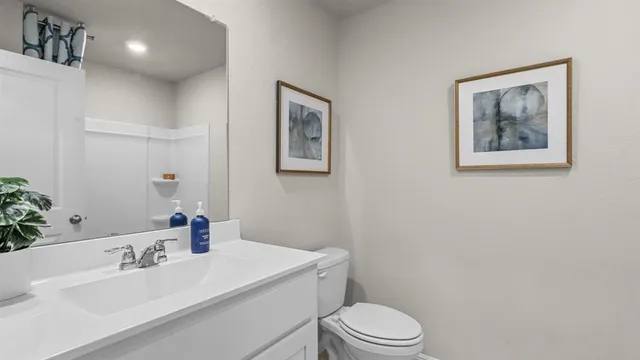 a bedroom with bed and cabinets