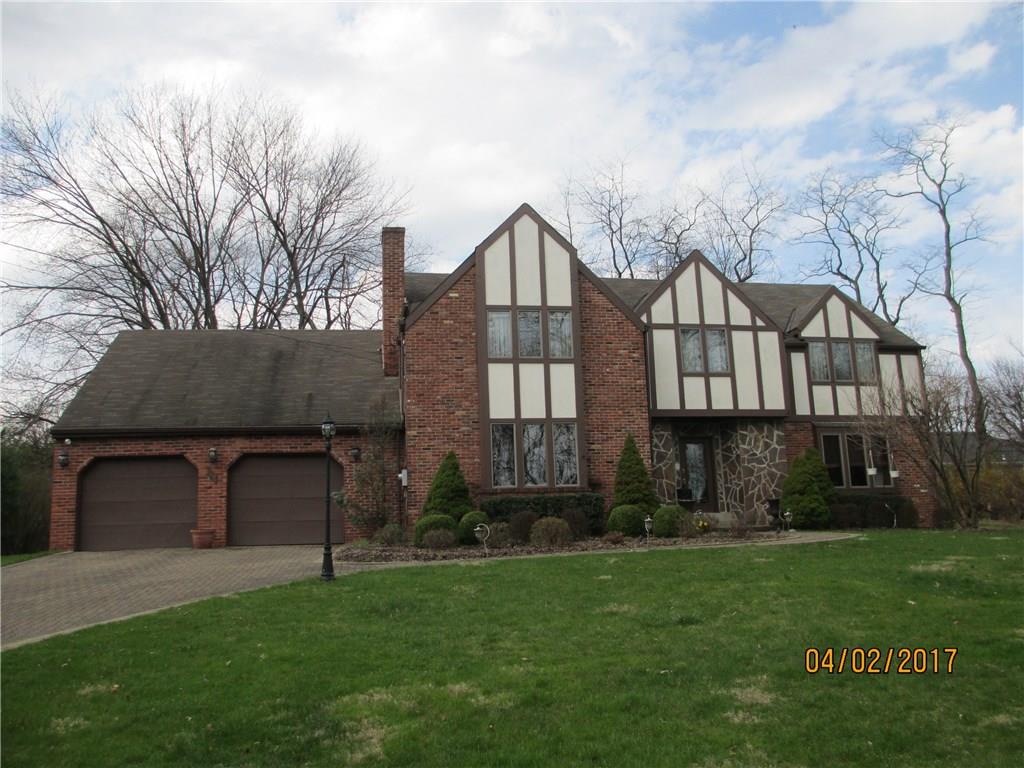 117 Parise Road Forest Hills, PA 15221 - Photo 1 of 23 a front view of a house with a garden and yard