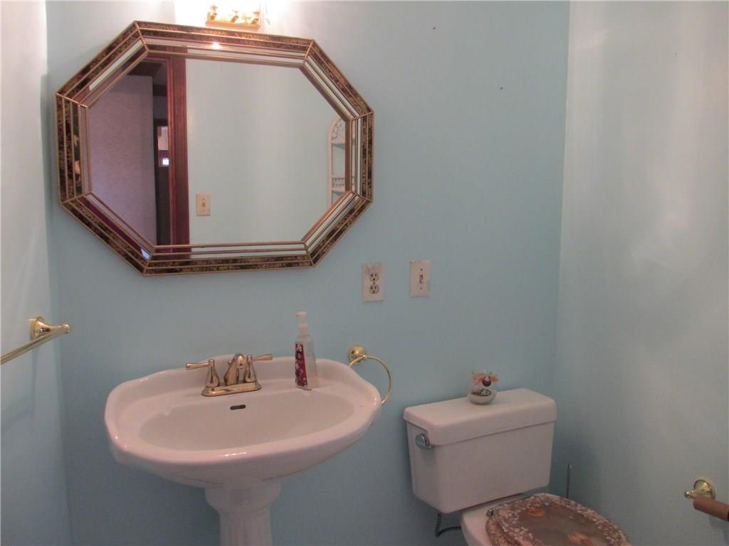 117 Parise Road Forest Hills, PA 15221 - Photo 11 of 23 a bathroom with a sink and mirror with toilet