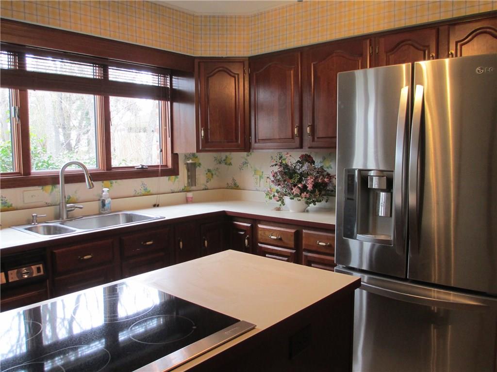 117 Parise Road Forest Hills, PA 15221 - Photo 15 of 23 a kitchen with stainless steel appliances a sink stove and refrigerator