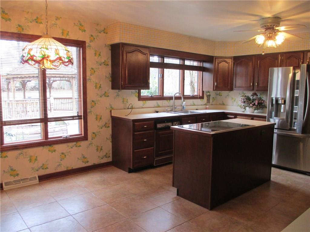117 Parise Road Forest Hills, PA 15221 - Photo 17 of 23 a kitchen with a sink and cabinets