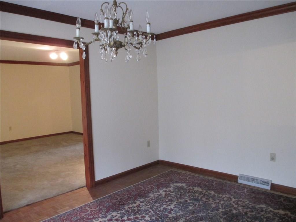 117 Parise Road Forest Hills, PA 15221 - Photo 18 of 23 a view of a big room with a chandelier fan