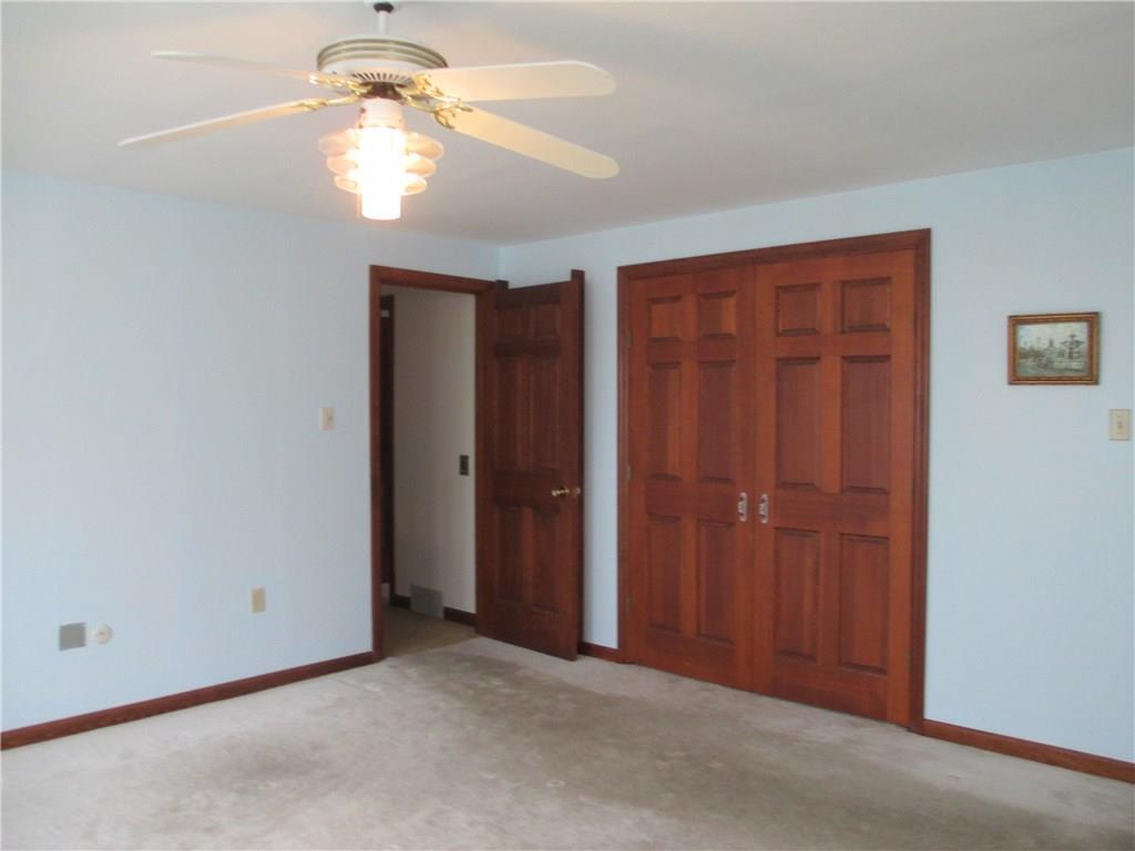 117 Parise Road Forest Hills, PA 15221 - Photo 23 of 23 an empty room with closet and a chandelier fan