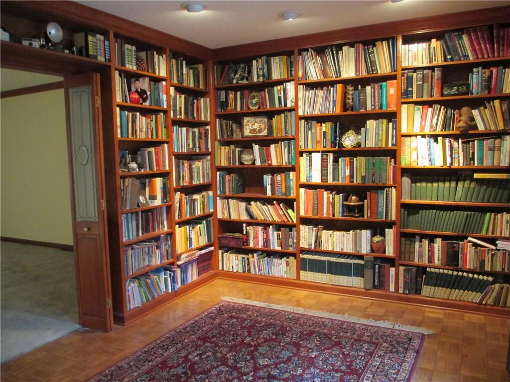 117 Parise Road Forest Hills, PA 15221 - Photo 10 of 23 a living room with a book shelf and a book shelf