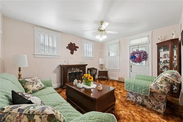 a living room with furniture and a fireplace