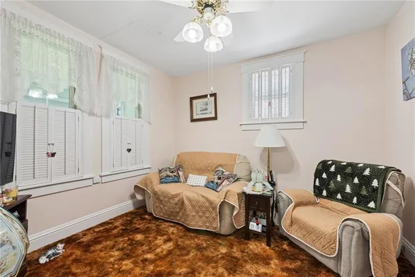 a bedroom with furniture and a window
