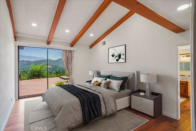 a bed room with a bed and a large window