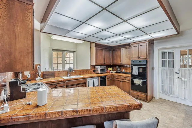 a bedroom with a bed and a chair