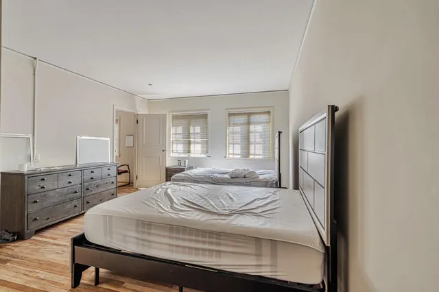 a view of livingroom with dining room and wooden floor