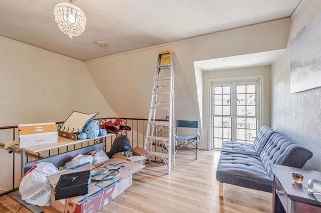 a bedroom with furniture and a closet