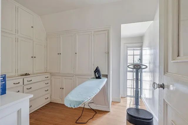 a bedroom with furniture and a window