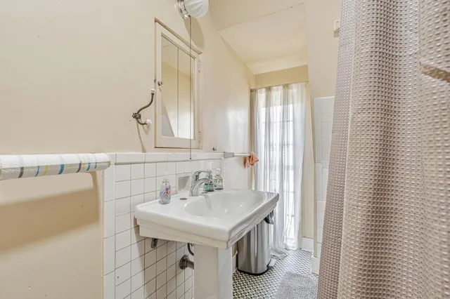 a kitchen with stainless steel appliances granite countertop a refrigerator and a stove