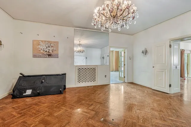 a view of a room with cabinet and windows