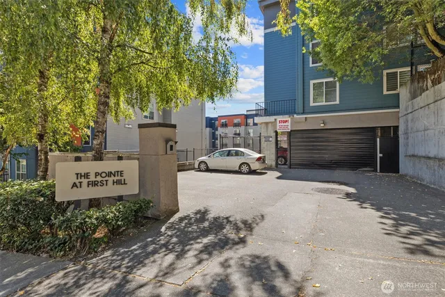 a sign board with parking space