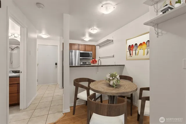 a view of a dining room with furniture and wooden floor